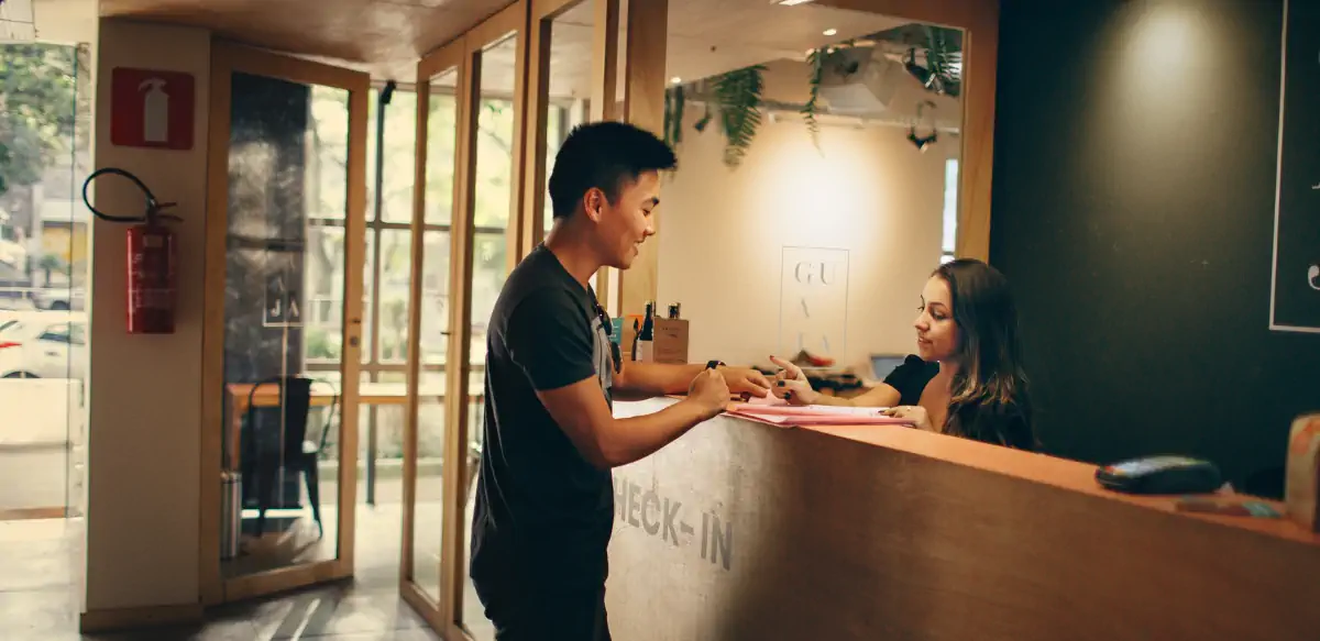 Hotel manager being polite at reception