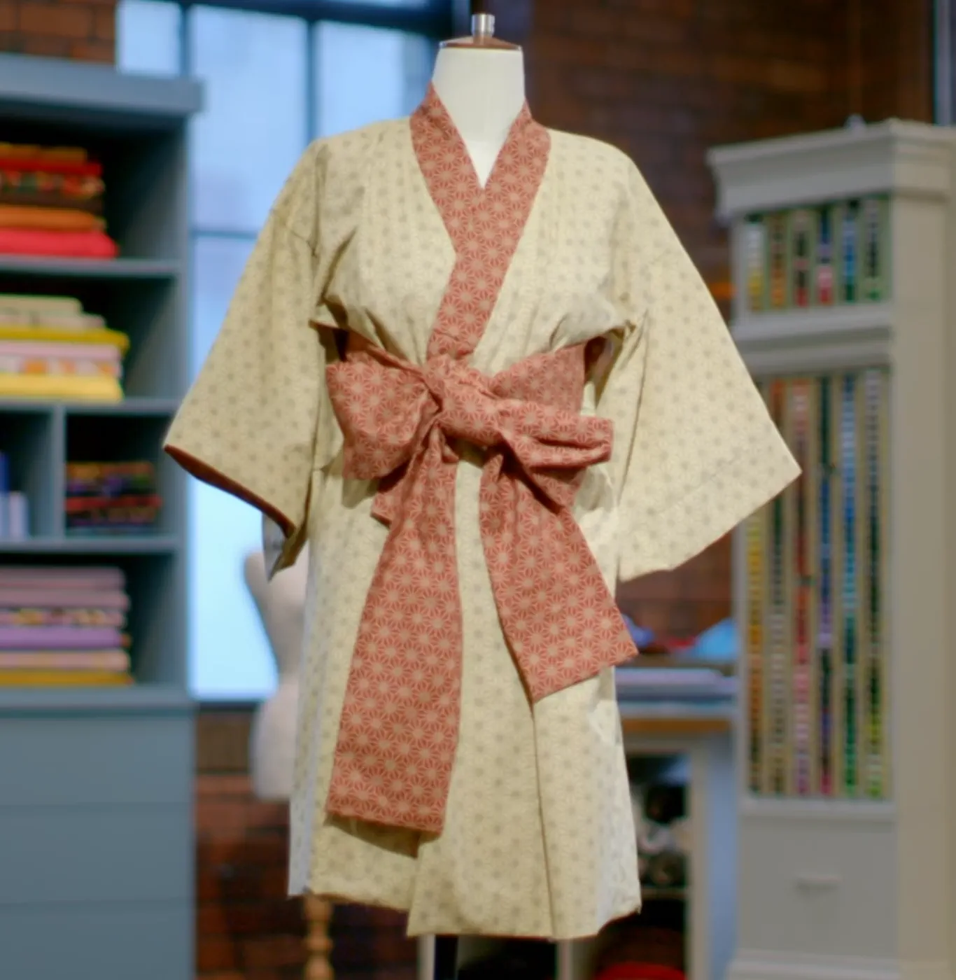 Kimono on a stand with a contrast collar and belt tied in a bow
