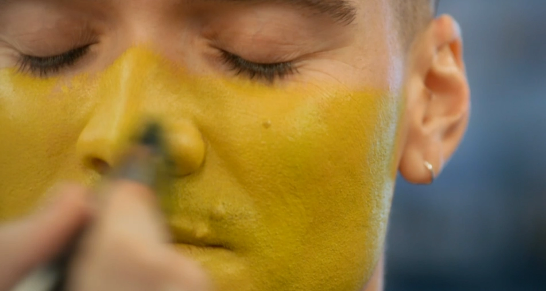 MUA applying colour up to the nose