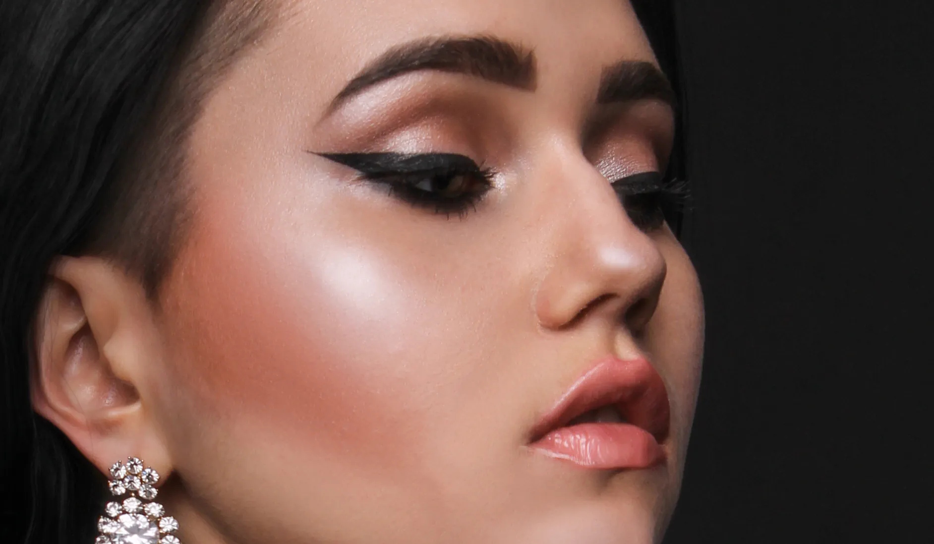 Model with prominent blusher and highlighter